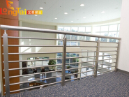 Stainless steel railing with pipes threaded through