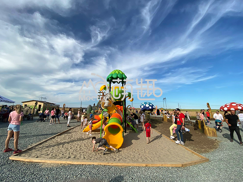 a plastic outdoor playground in one amusement park, many people around.